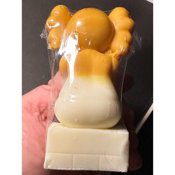 KAWS - (sitting covering face) - Yellow and White CANDLE - Picture 2 of 5